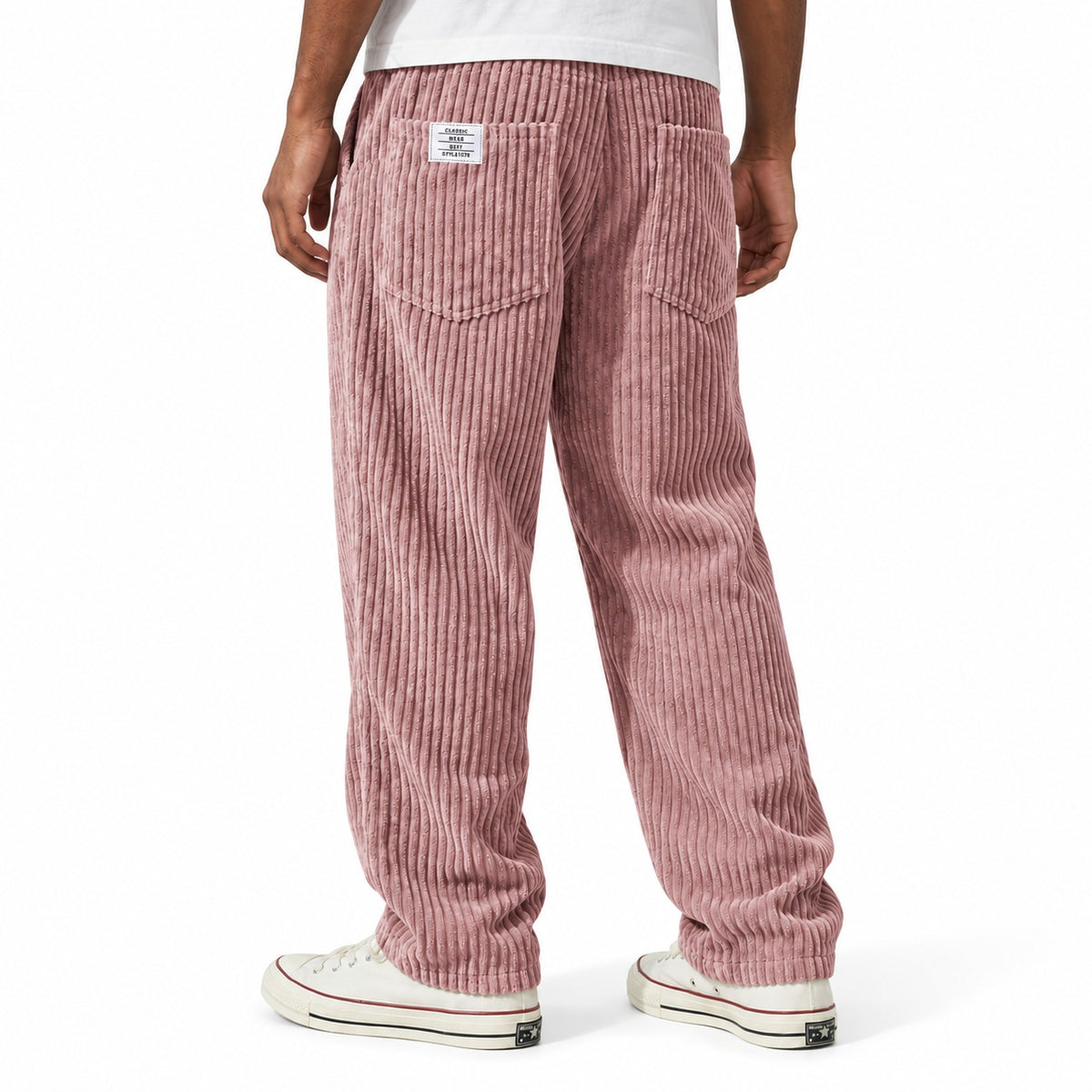 Dusty Pink ribbed straight-leg trousers shown from the rear three-quarter, with elasticated waist and rear patch pockets