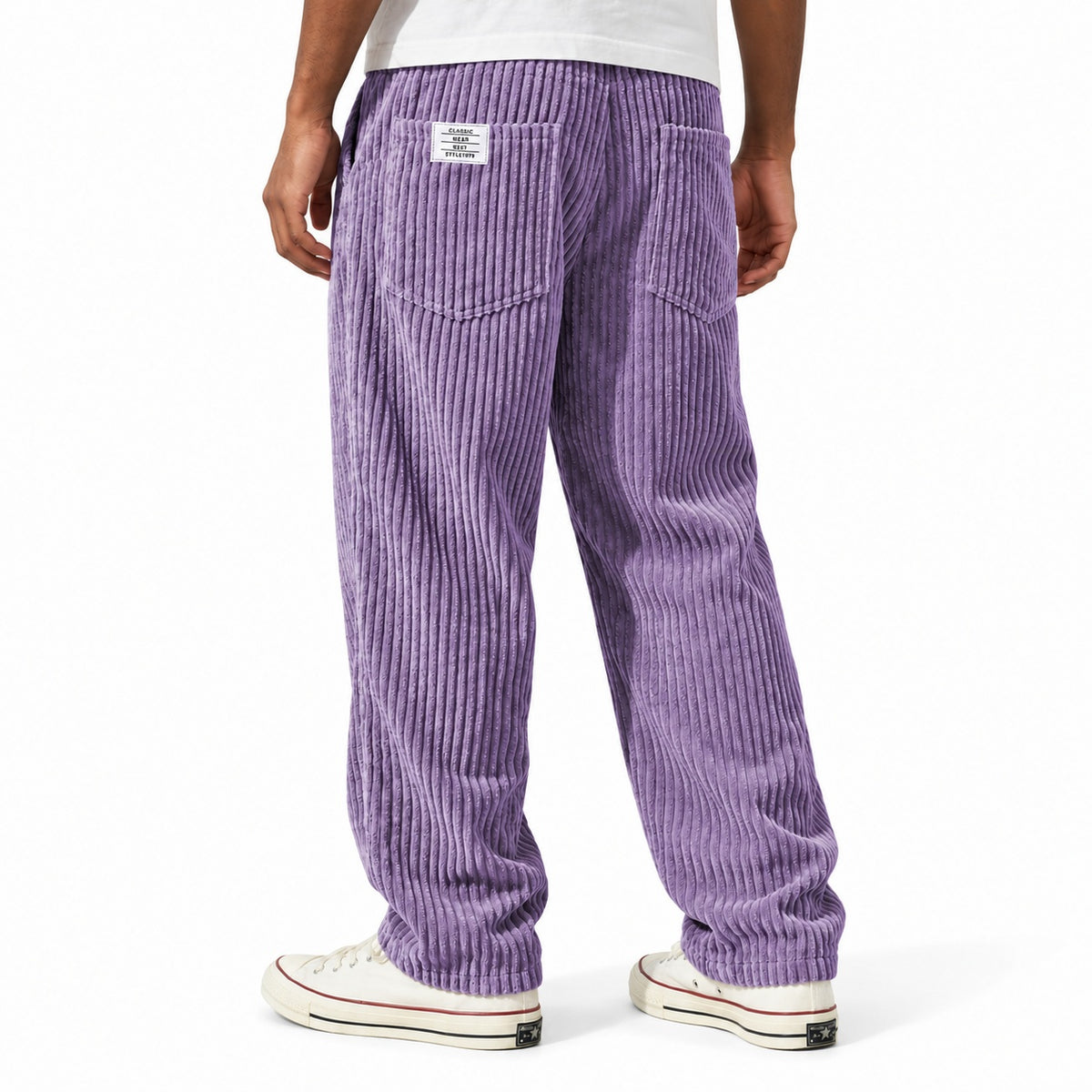 Purple ribbed straight-leg trousers shown from the rear three-quarter, with elasticated waist and rear patch pockets