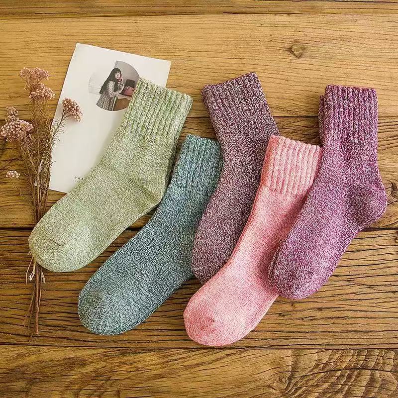 Five-pair thermal wool-blend socks – five pairs arranged on wood