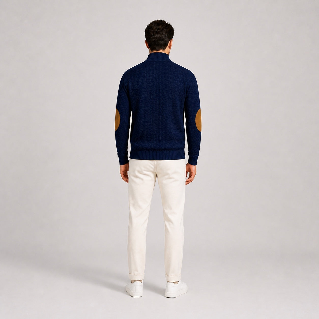 Model wearing the Deep Navy men's textured stand-collar pullover with white trousers, back full-body studio view