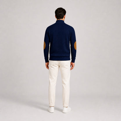Model wearing the Deep Navy men's textured stand-collar pullover with white trousers, back full-body studio view