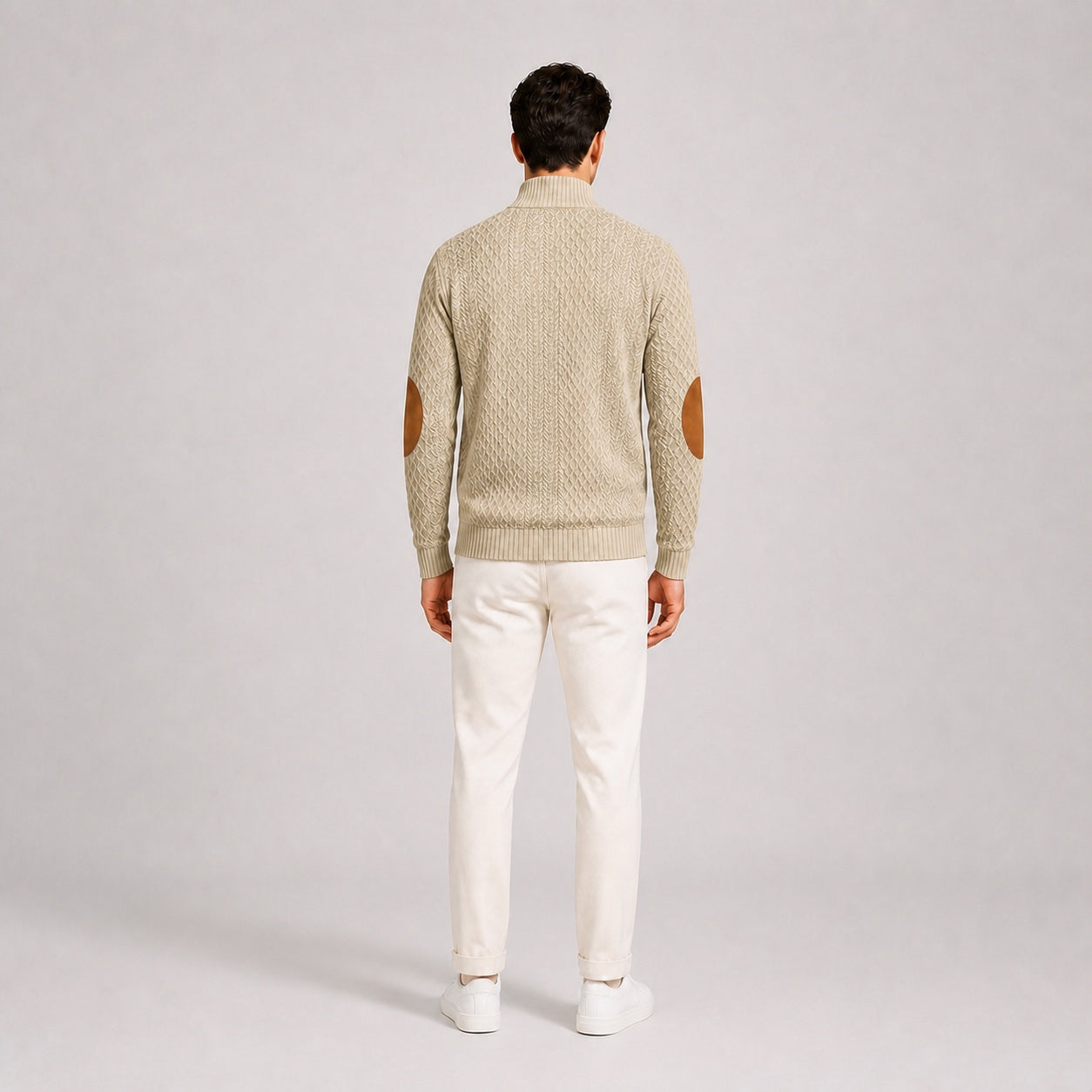 Model wearing the Oatmeal men's textured stand-collar pullover with white trousers, back full-body studio view