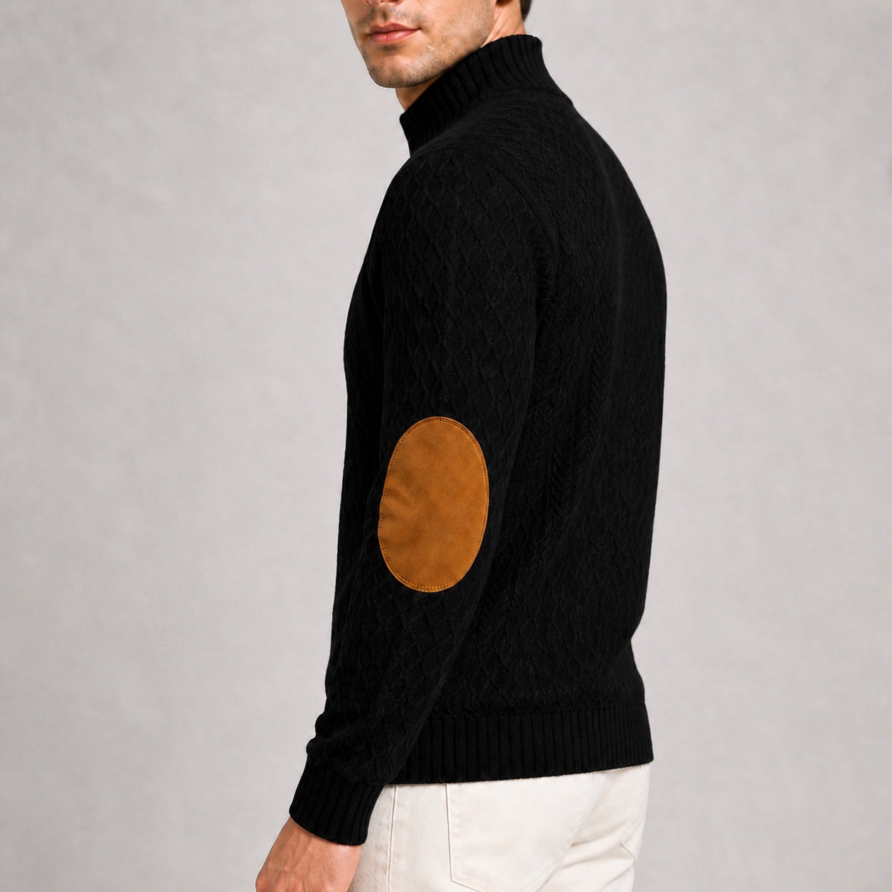 Close-up of the contrast elbow patch and jacquard texture on the Black men's stand-collar pullover