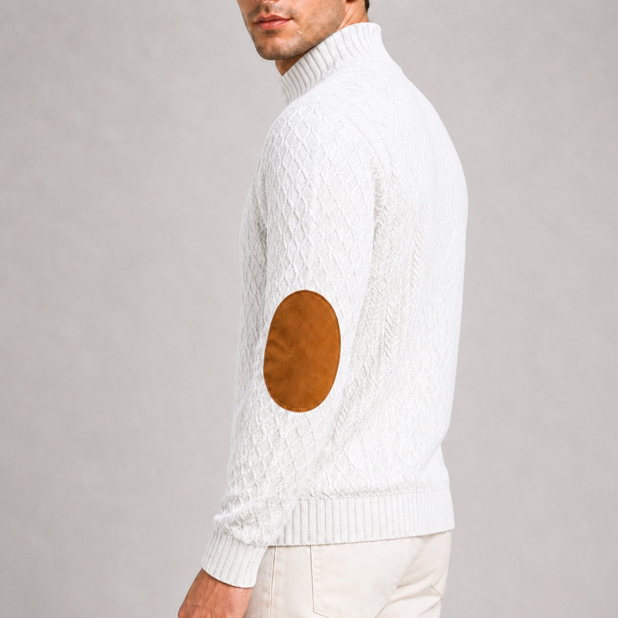 Close-up of the contrast elbow patch and jacquard texture on the White men's stand-collar pullover