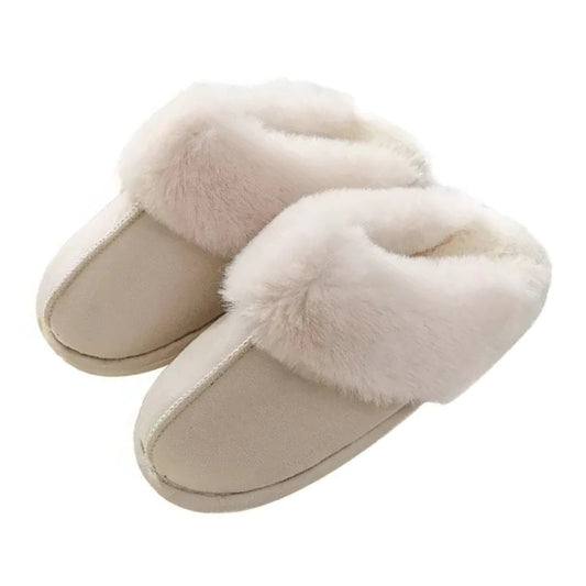 Pair of beige faux fur slippers on a white background