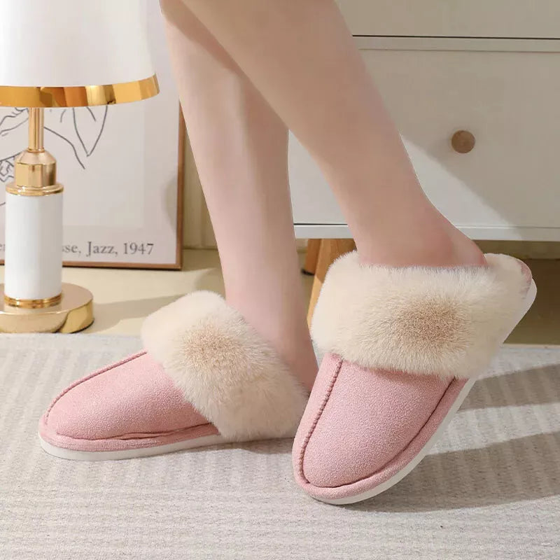 Pink faux fur slippers styled with light loungewear