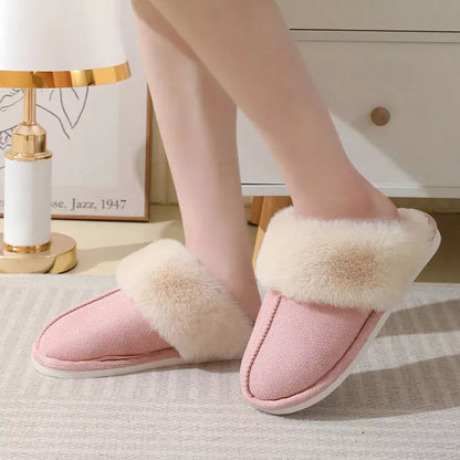 Pink faux fur slippers styled with light loungewear