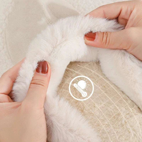 Close-up of plush slipper lining with a care symbol