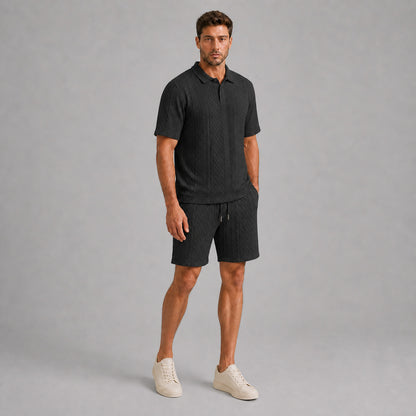 Black men's textured jacquard polo shirt and shorts set, natural 45-degree full-body view