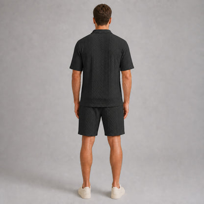 Black men's textured jacquard polo shirt and shorts set, back full-body view