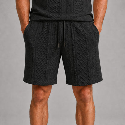 Black men's drawstring shorts, raised geometric texture close-up