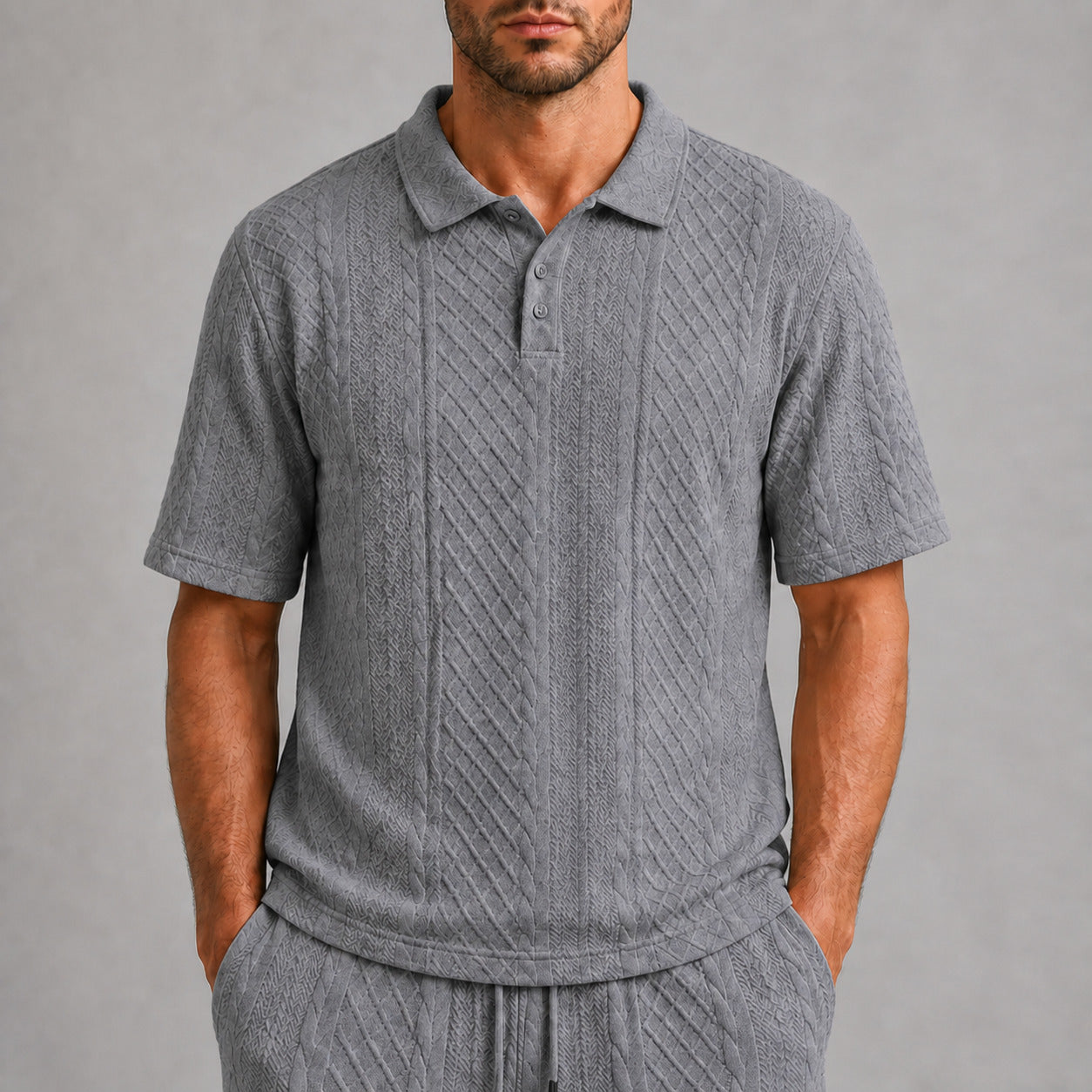 Mid Grey men's textured jacquard polo shirt, raised geometric texture close-up