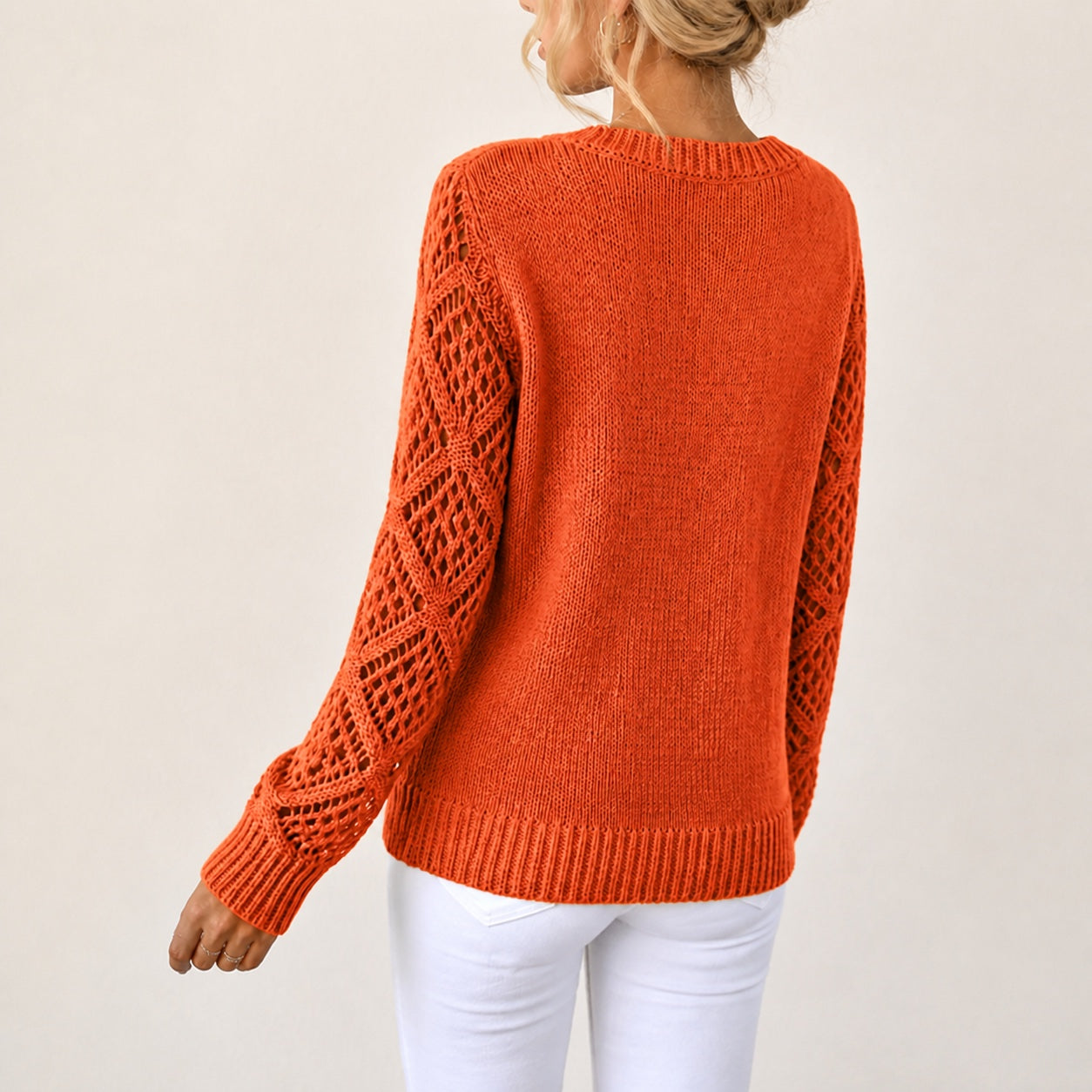 Burnt Orange women's V-neck openwork sleeve knitted jumper, rear three-quarter view