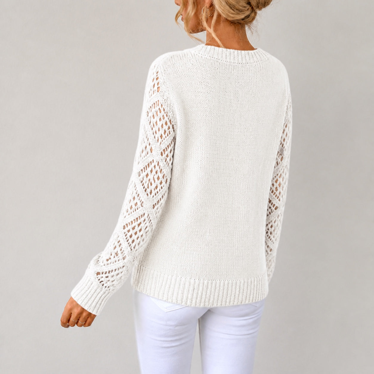 White women's V-neck openwork sleeve knitted jumper, rear three-quarter view