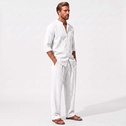 White men's two piece linen-blend set with Grandad collar shirt and straight-leg trousers, three-quarter model view