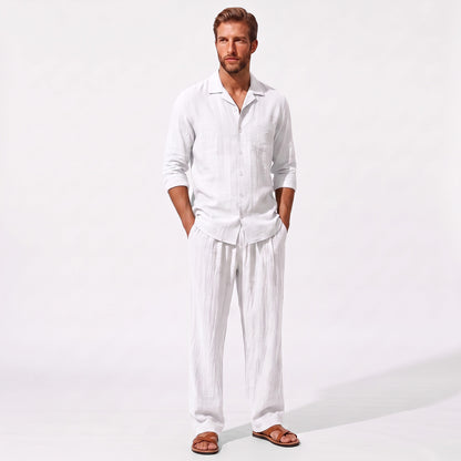 White men's two piece linen-blend set with Grandad collar shirt and straight-leg trousers, front model view with hands in pockets