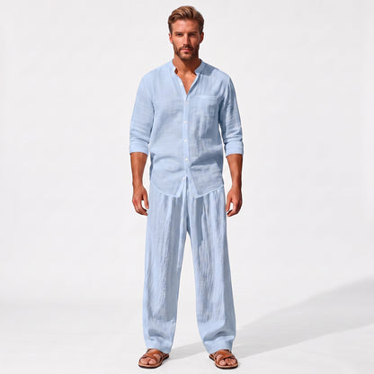 Blue men's two piece linen-blend set with Grandad collar shirt and straight-leg trousers, straight-on full-length model view