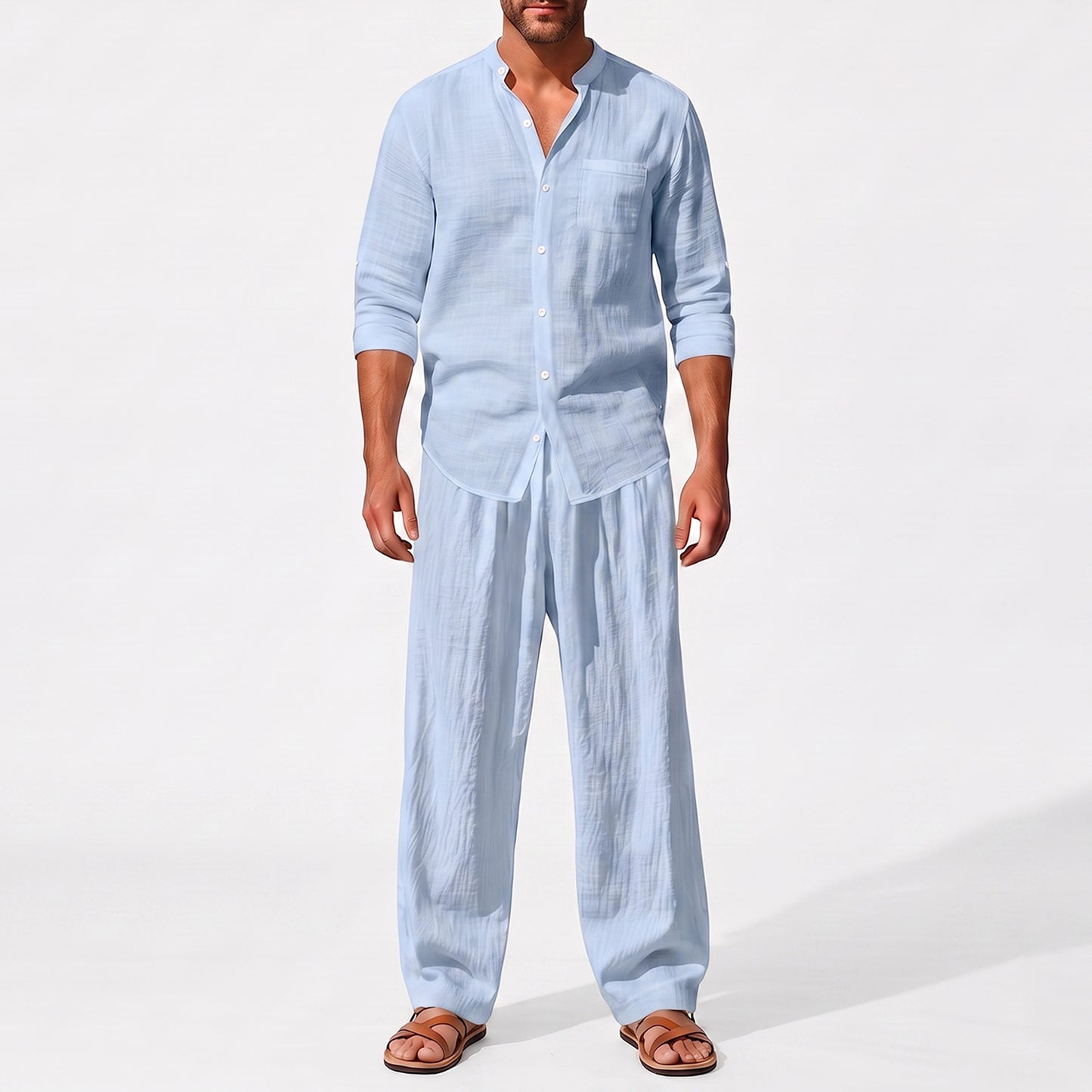 Blue men's two piece linen-blend set with Grandad collar shirt and straight-leg trousers, closer front outfit view