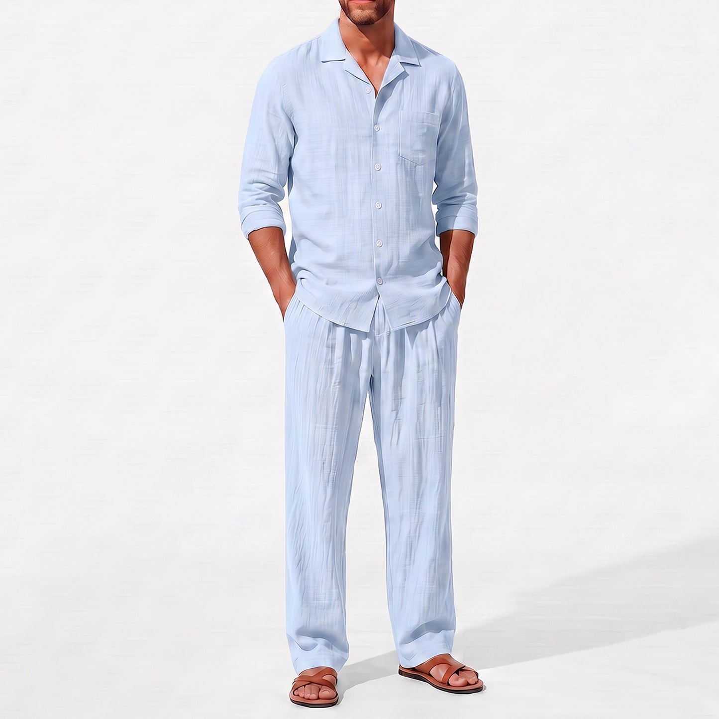 Blue men's two piece linen-blend set with Grandad collar shirt and straight-leg trousers, close front outfit detail