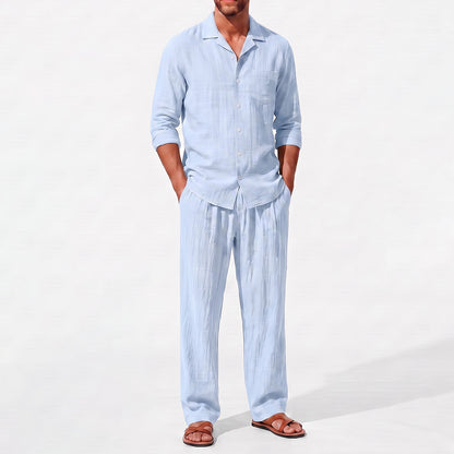 Blue men's two piece linen-blend set with Grandad collar shirt and straight-leg trousers, close front outfit detail