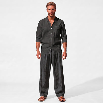 Black men's two piece linen-blend set with Grandad collar shirt and straight-leg trousers, straight-on full-length model view