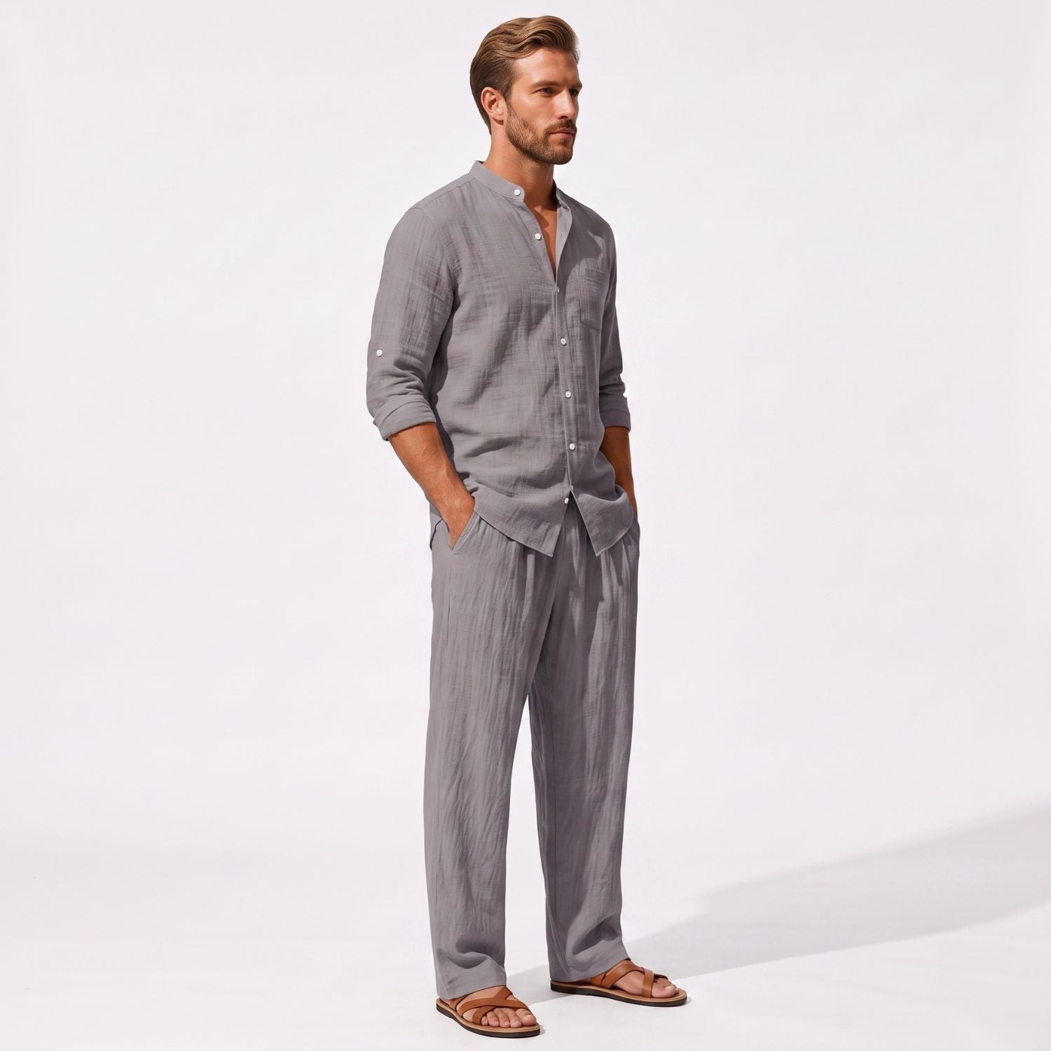 Grey men's two piece linen-blend set with Grandad collar shirt and straight-leg trousers, three-quarter model view