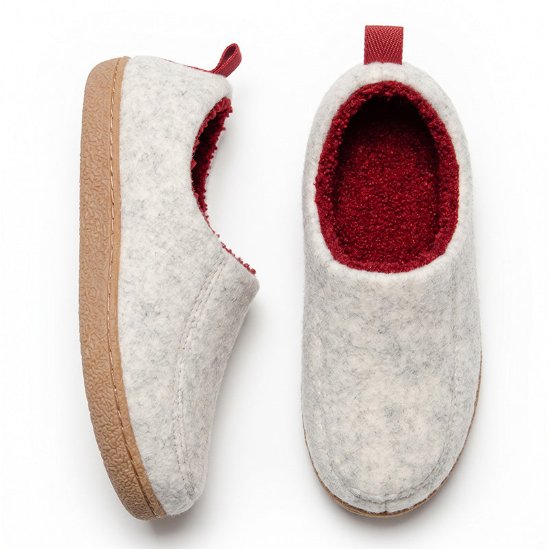 White house slippers in top and side views, showing red fleece lining and tan sole edges