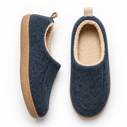 Navy house slippers in top and side views, showing cream fleece lining and tan sole edges