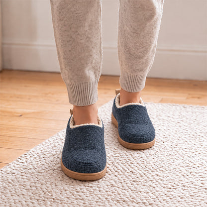 Navy house slippers with cream lining, shown from the front while worn