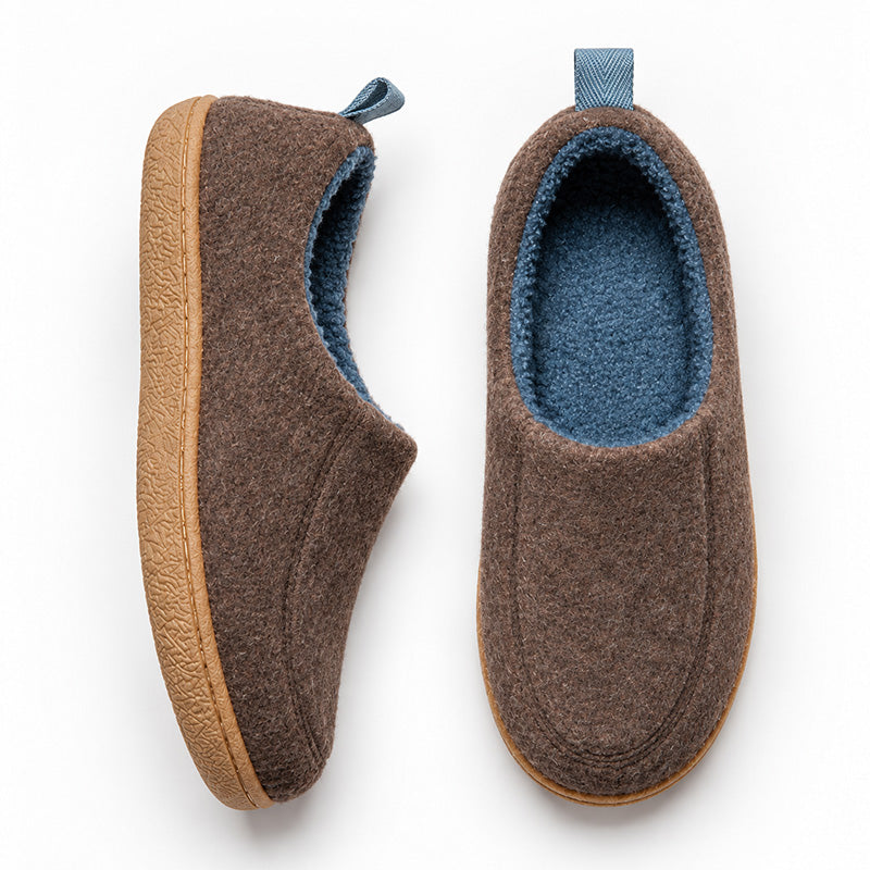 Brown house slippers in top and side views, showing blue fleece lining and tan sole edges