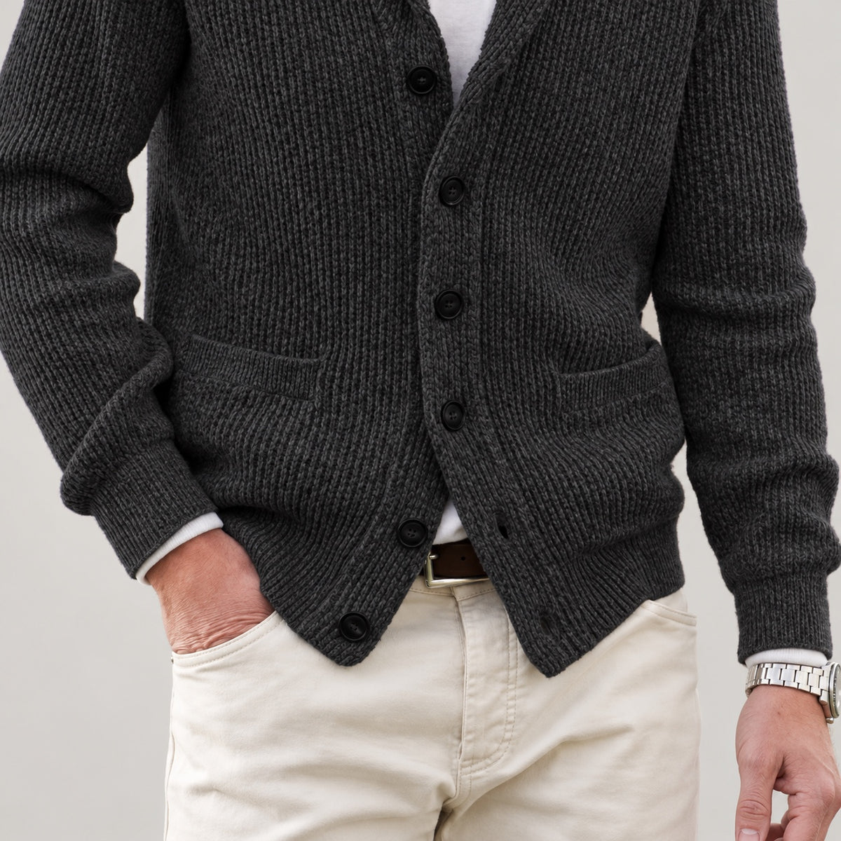 Charcoal cardigan front patch pockets, knit texture and lower hem