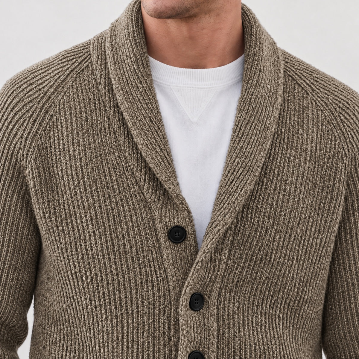 Shawl collar and upper front button detail on the khaki cardigan