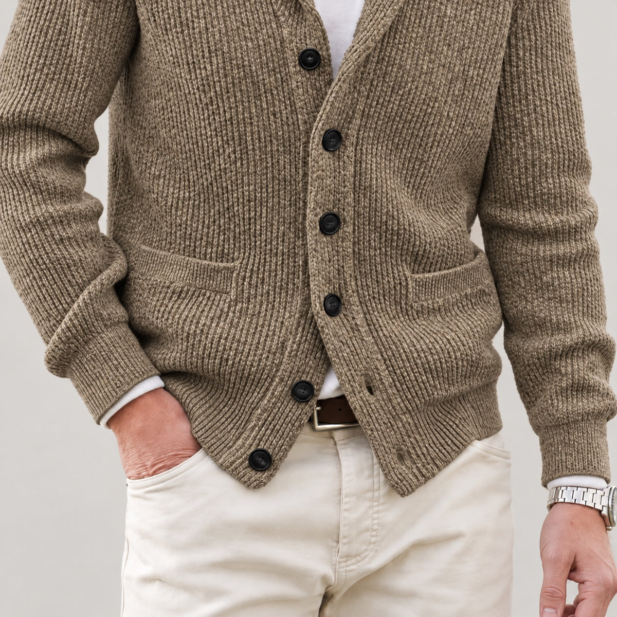 Front patch pockets, knit texture and lower hem on the khaki cardigan