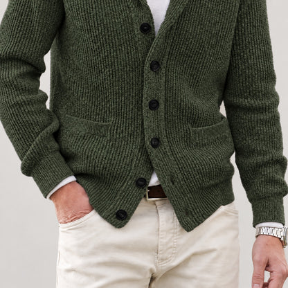 Front patch pockets, knit texture and lower hem on the olive green cardigan