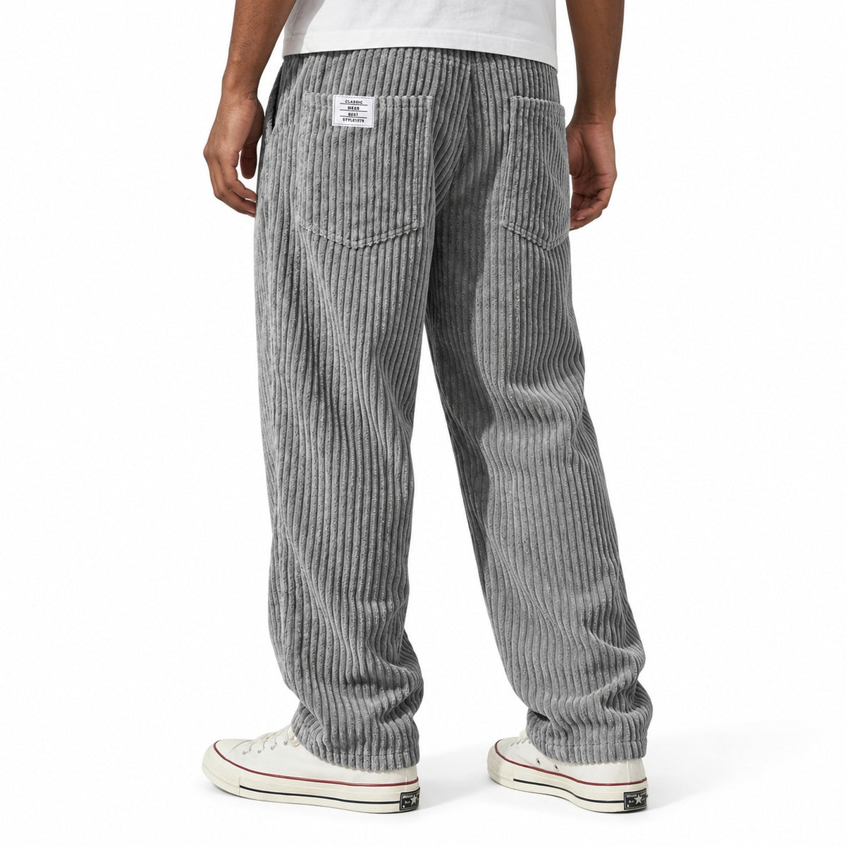 Grey ribbed straight-leg trousers shown from the rear three-quarter, with elasticated waist and rear patch pockets