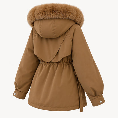Rear three-quarter view of the brown parka showing the rounded layered back yoke, gathered waist and fluffy hood trim.