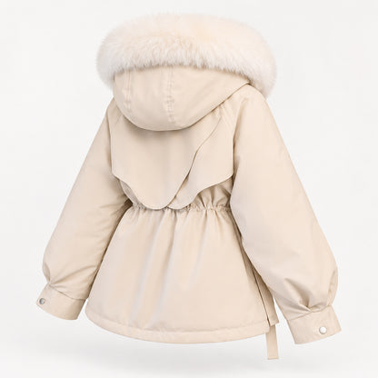 Cream hooded parka in a rear three-quarter view showing the rounded layered back panel, gathered waist and snap cuffs.