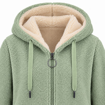 Green longline sherpa hoodie, hood, cream lining, flat drawstrings and circular zipper pull detail.