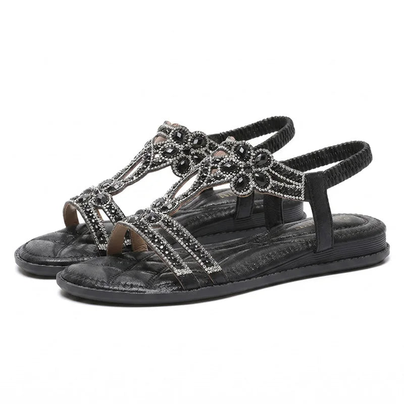 Black rhinestone slingback sandals for women, pair on white background