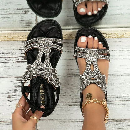 Black embellished sandals for women, top-down on-foot view