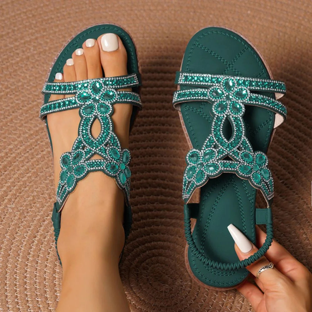 Dark green embellished slingback sandals, top-down pair view