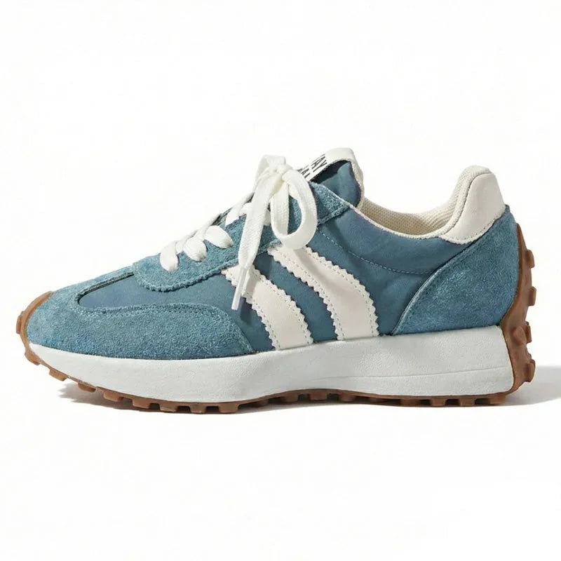 Women's blue and white walking trainers, side profile on a white background