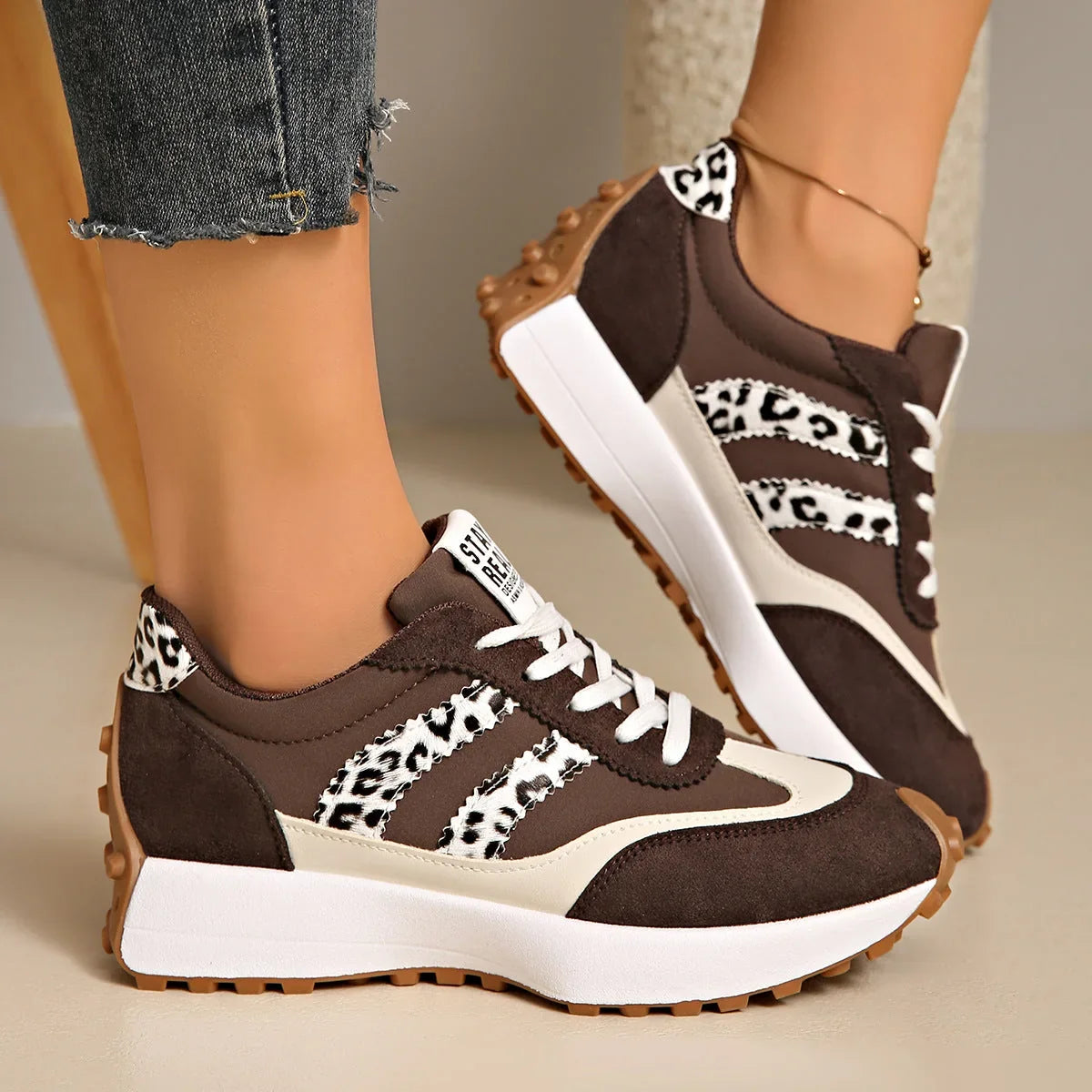 Women's brown and white walking trainers with leopard-print accents