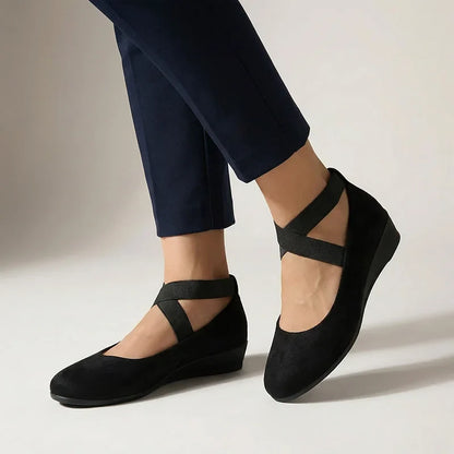 Black Mary Jane wedge flats, on-foot studio view