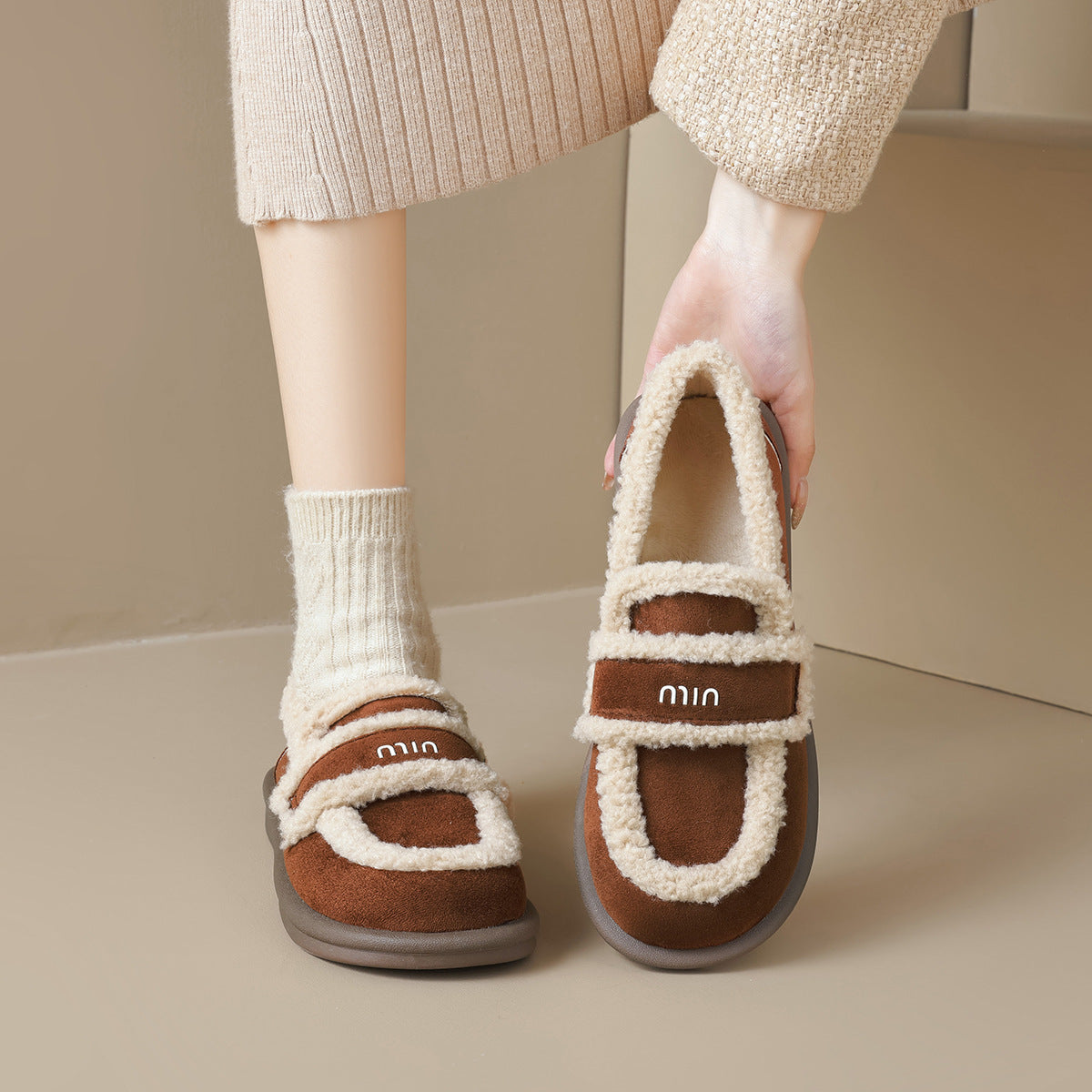 Auldweave women's fleece-lined slip-on loafers – brown pair held from the front