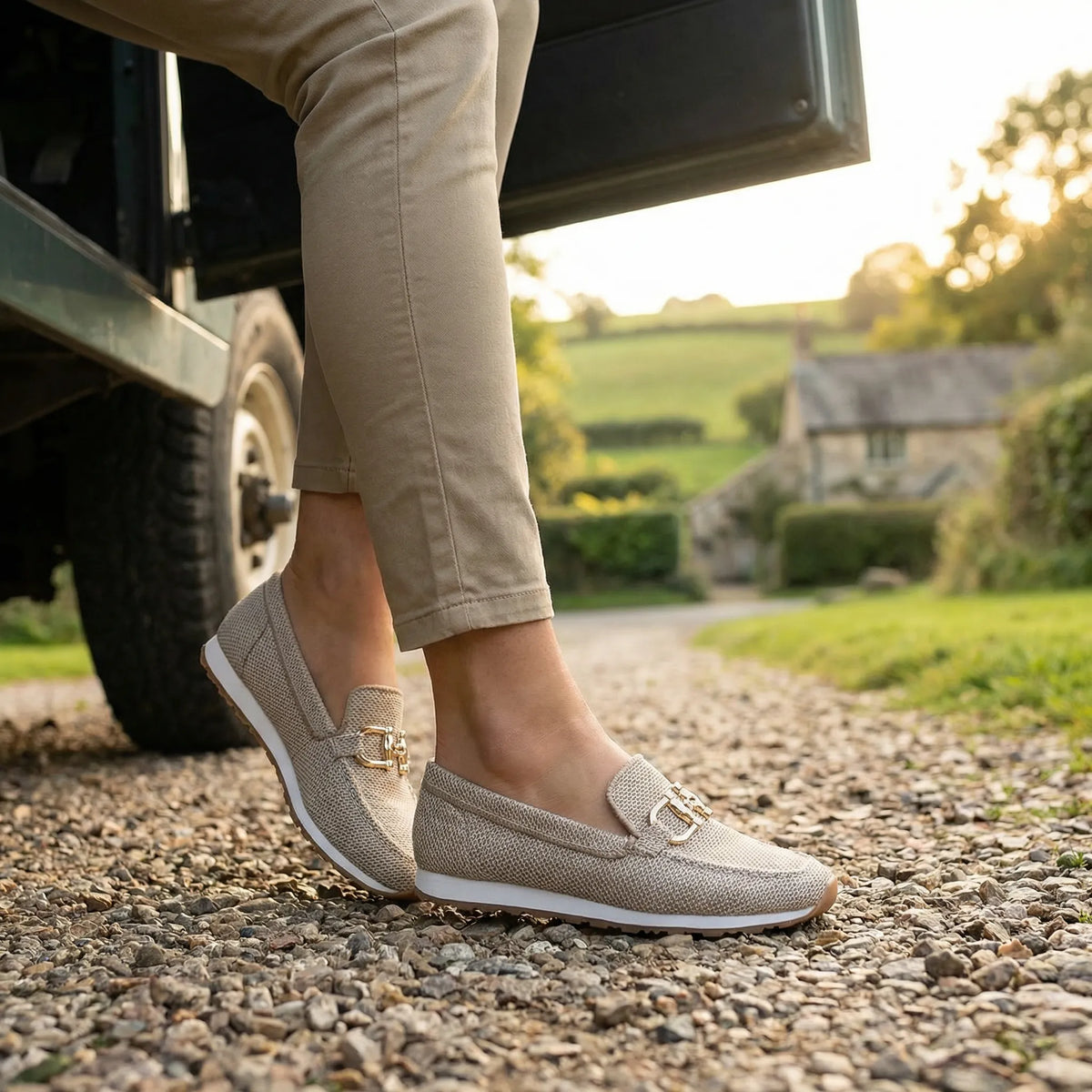 Women's khaki loafers shown on foot