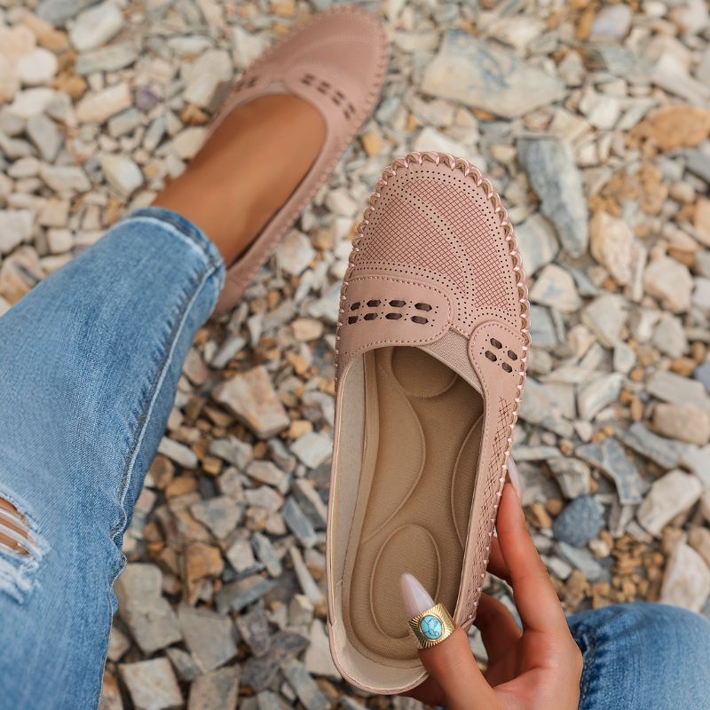 Blush pink women's leather loafers showing the shaped insole and perforated upper