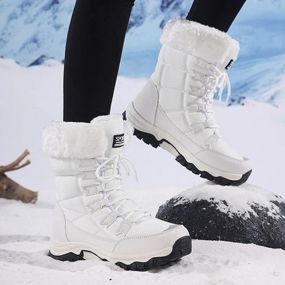 Side view of white winter boots showing the sole and lace-up upper