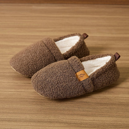 Auldweave women's warm shearling slippers – brown pair on a wooden floor