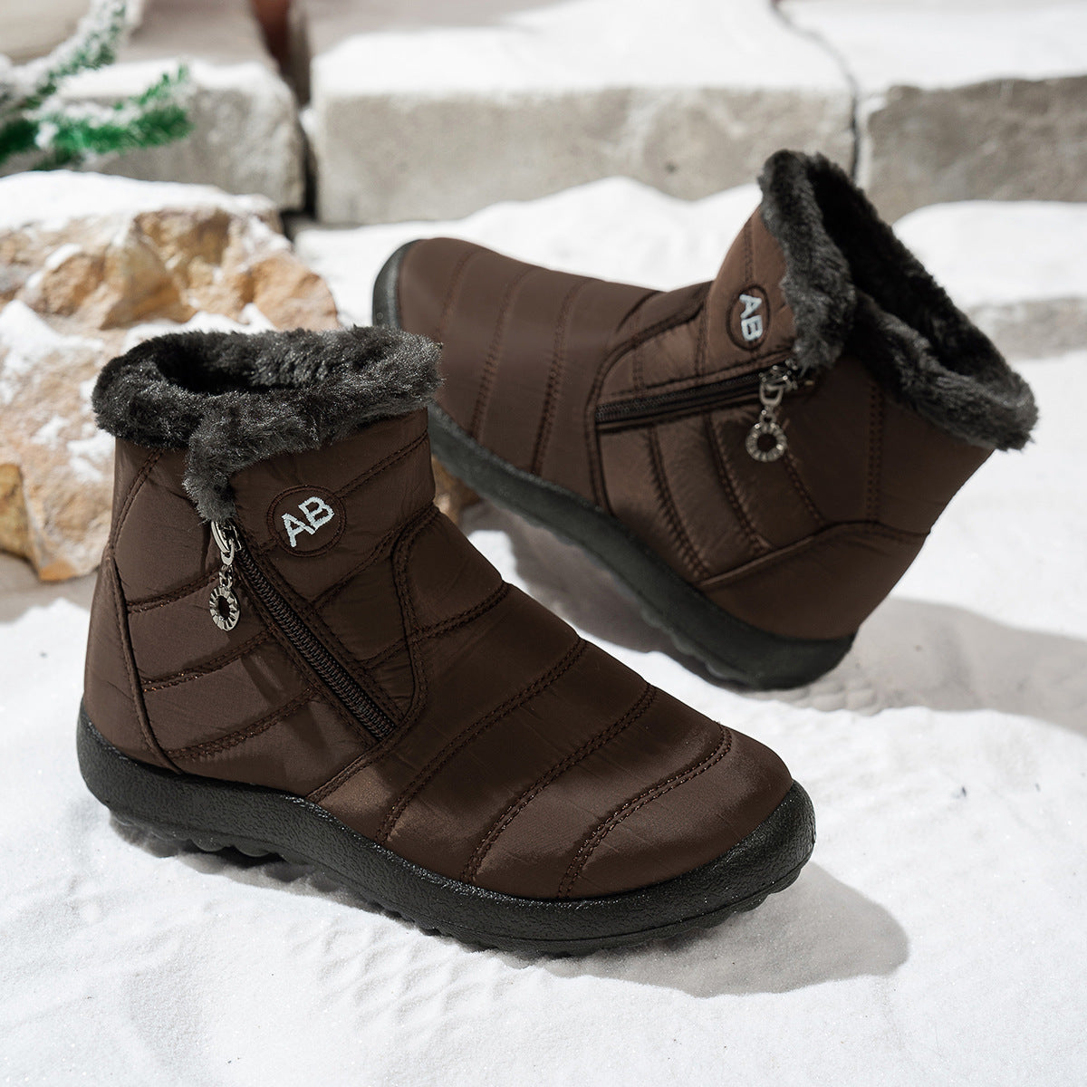 Side view of brown winter boots showing the zipper and fleece collar
